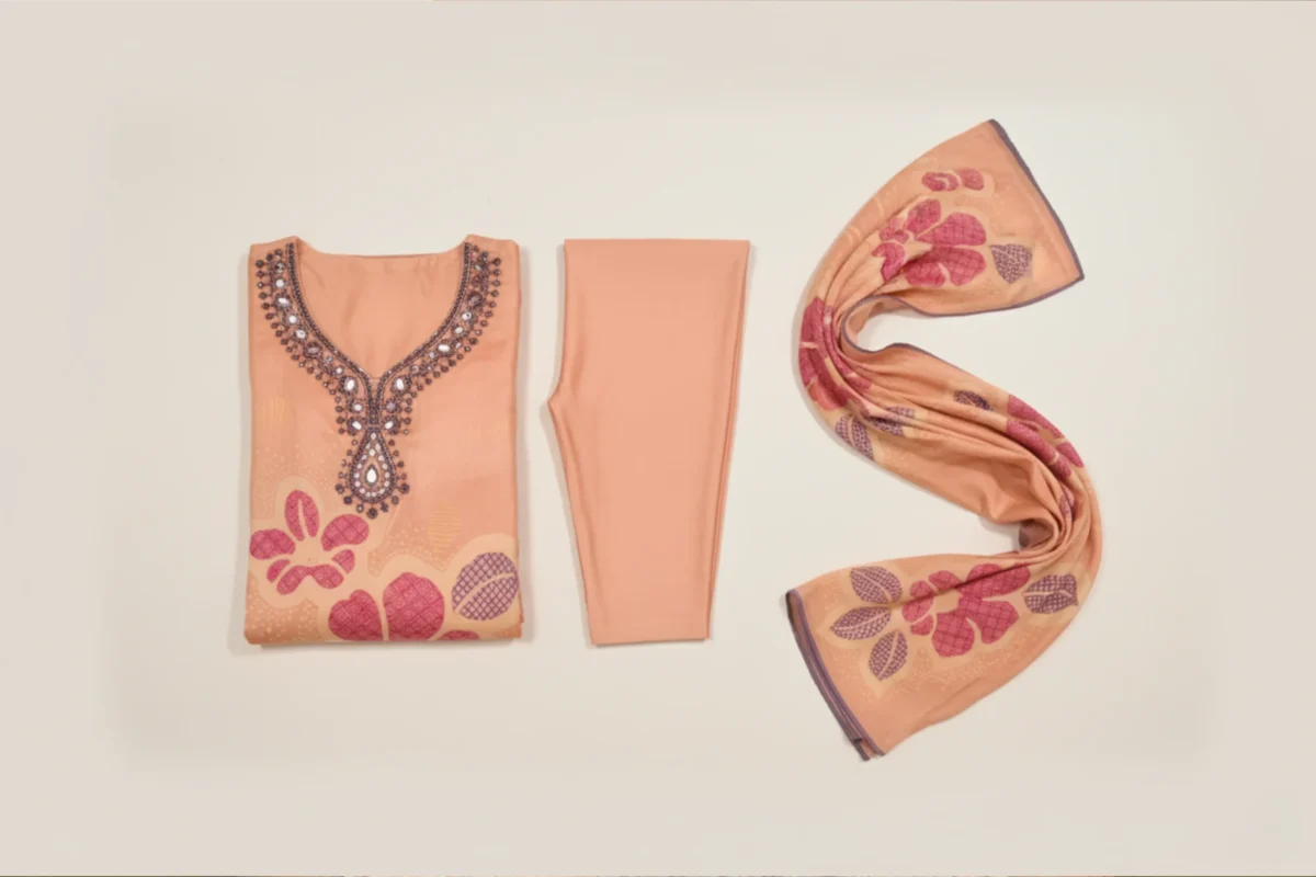 Peach fancy suit with intricate handwork and floral printed dupatta — elegant ethnic wear for women by Rangoli Saris.