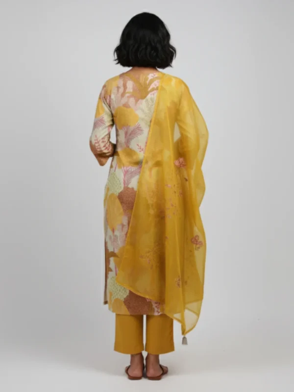 Printed khadi suit with earthy floral motifs, paired with a mustard dupatta and matching pants — perfect for festive daytime elegance.