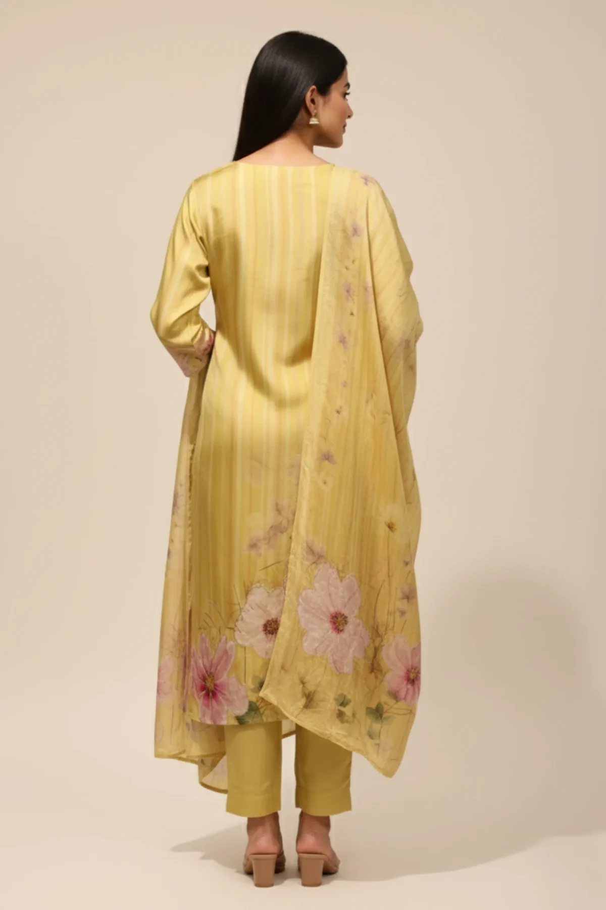 Pale yellow muslin suit with floral print and delicate handwork embroidery — elegant ethnic wear for women by Rangoli Saris.