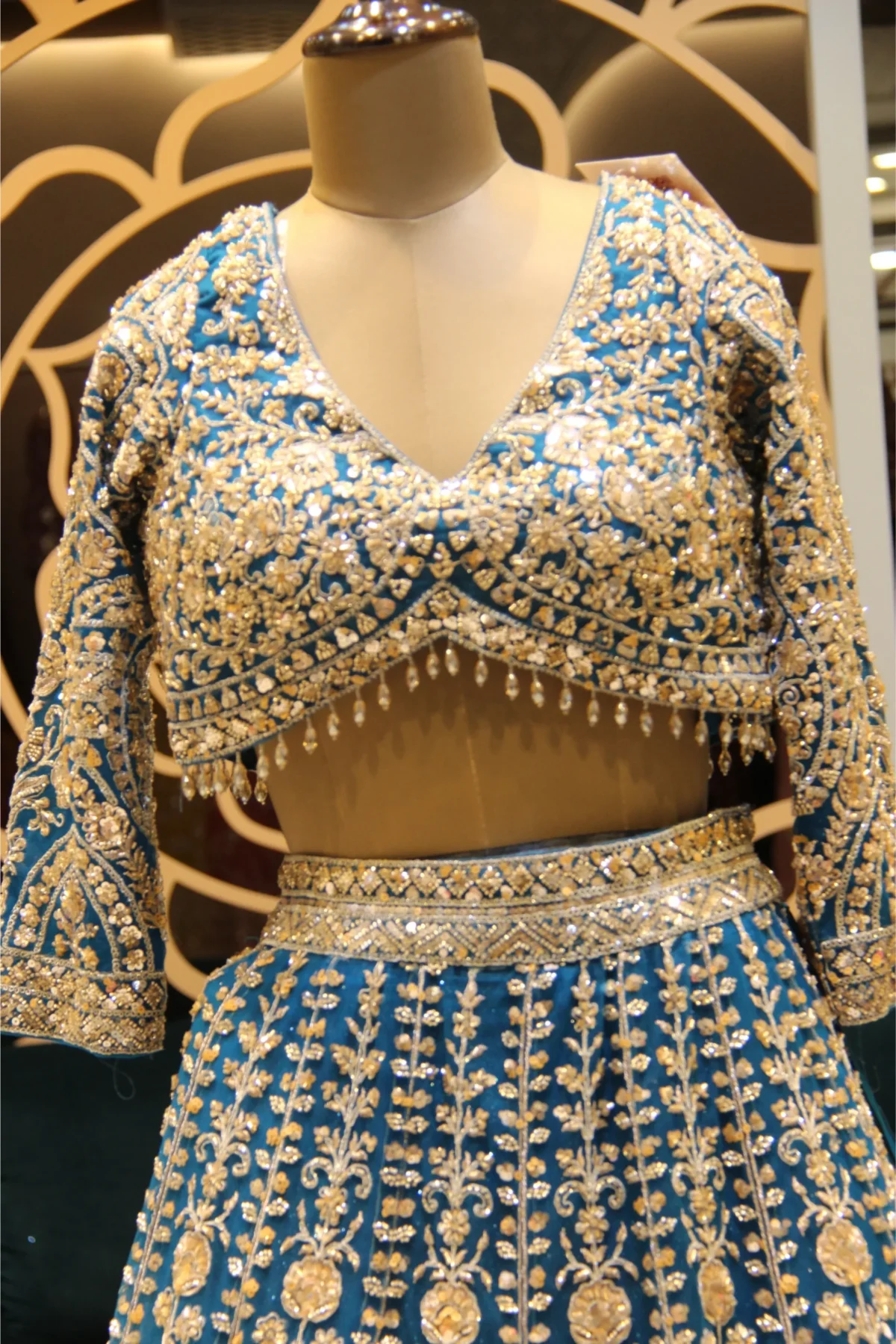 Royal Blue designer net lehenga embellished with beads and crystals, paired with matching blouse and dupatta – perfect for weddings and festive occasions.