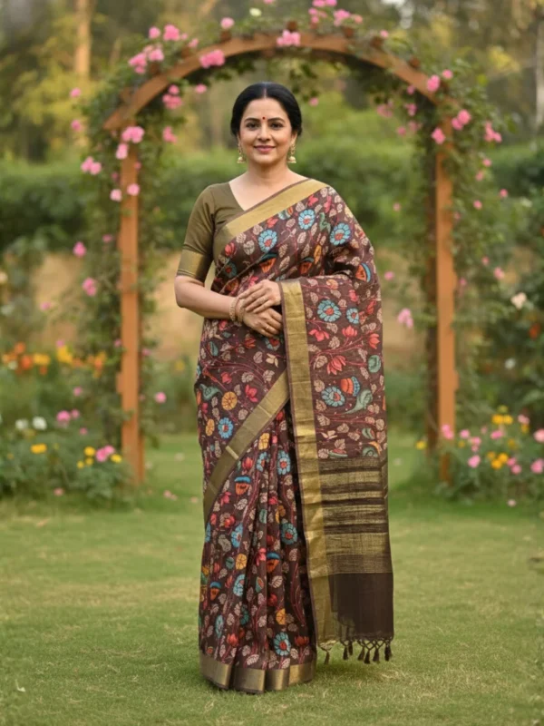 Woman wearing brown Moonga Tussar saree with Pichwai, Patola, and Kalamkari-inspired prints, woven zari border, and intricate pallu – Rangoli Saris