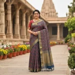 Woman wearing royal indigo Moonga Tussar saree with Patola-inspired print and woven zari border – Rangoli Saris