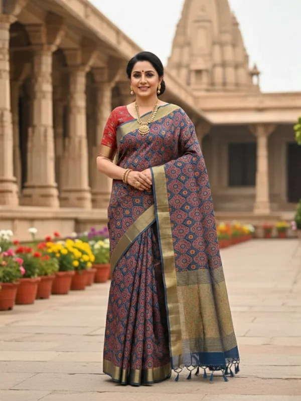 Woman wearing royal indigo Moonga Tussar saree with Patola-inspired print and woven zari border – Rangoli Saris