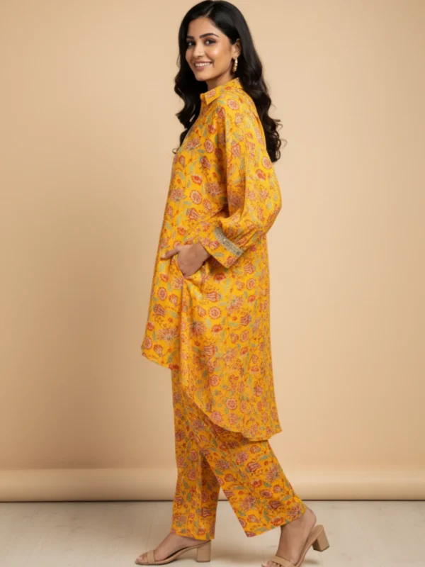 Bright Yellow Muslin Printed Co-Ord Set with floral motifs and asymmetrical hem kurta – Rangoli Saris