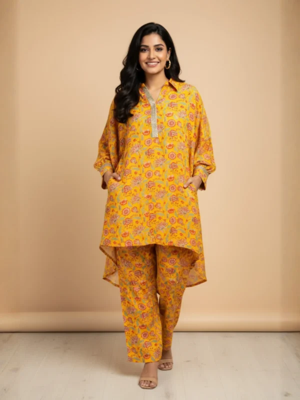 Bright Yellow Muslin Printed Co-Ord Set with floral motifs and asymmetrical hem kurta – Rangoli Saris
