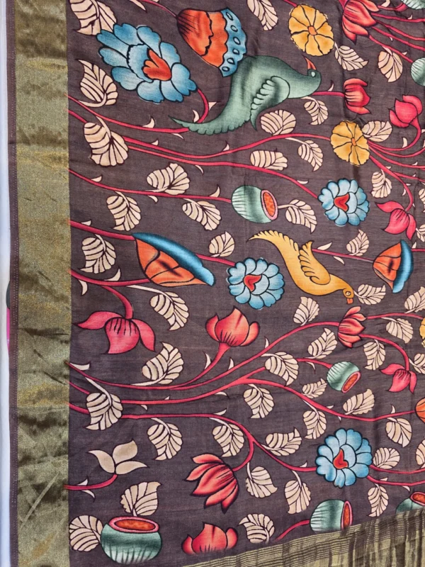 Woman wearing brown Moonga Tussar saree with Pichwai, Patola, and Kalamkari-inspired prints, woven zari border, and intricate pallu – Rangoli Saris