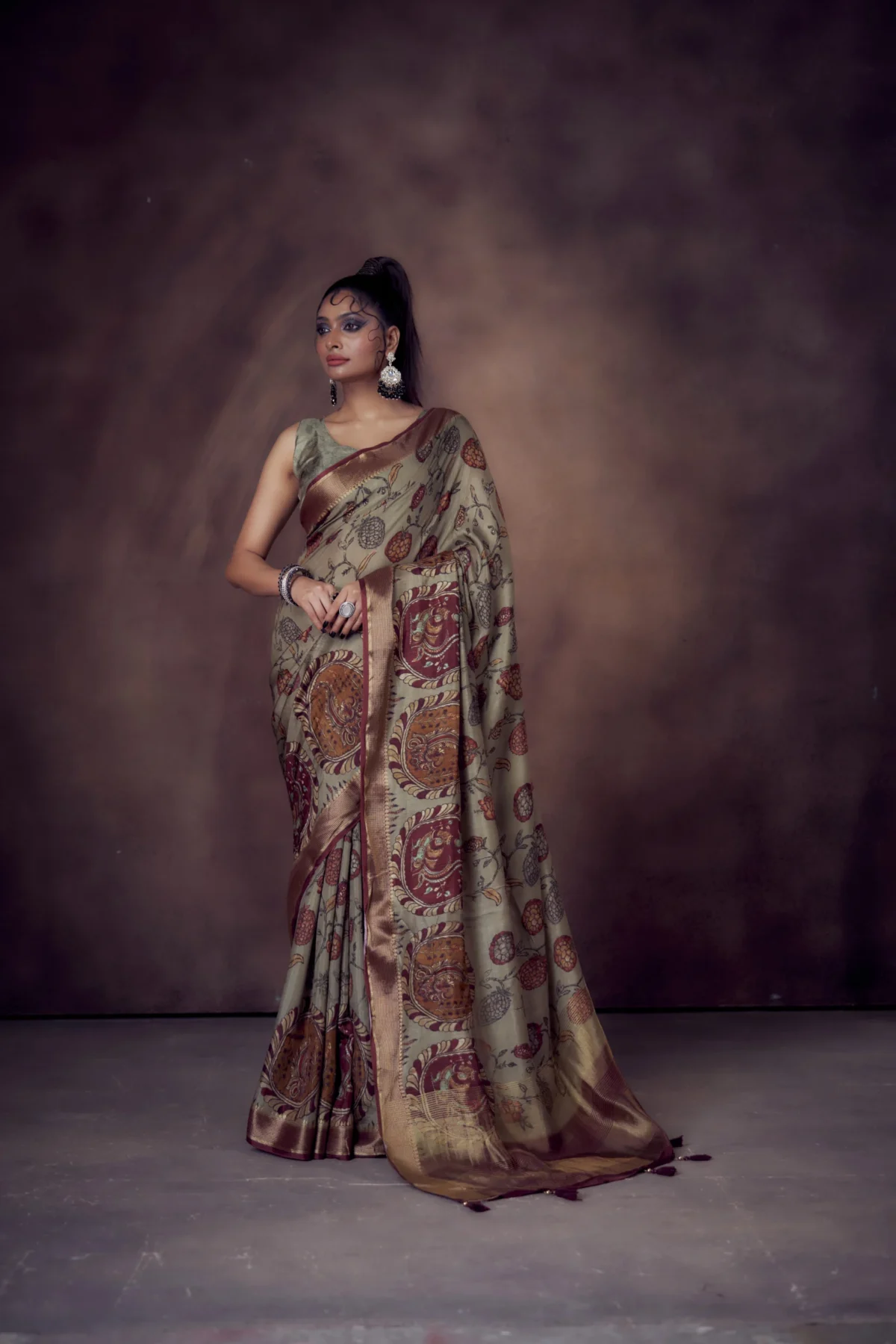Olive Moonga Tussar saree with Pichwai Kalamkari traditional prints and woven zari border