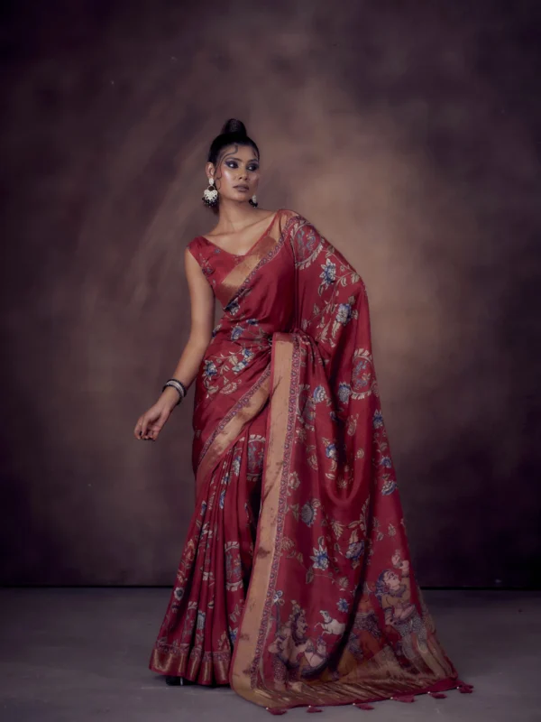 Ruby Moonga Tussar saree with Kalamkari and Pichwai prints featuring woven zari border