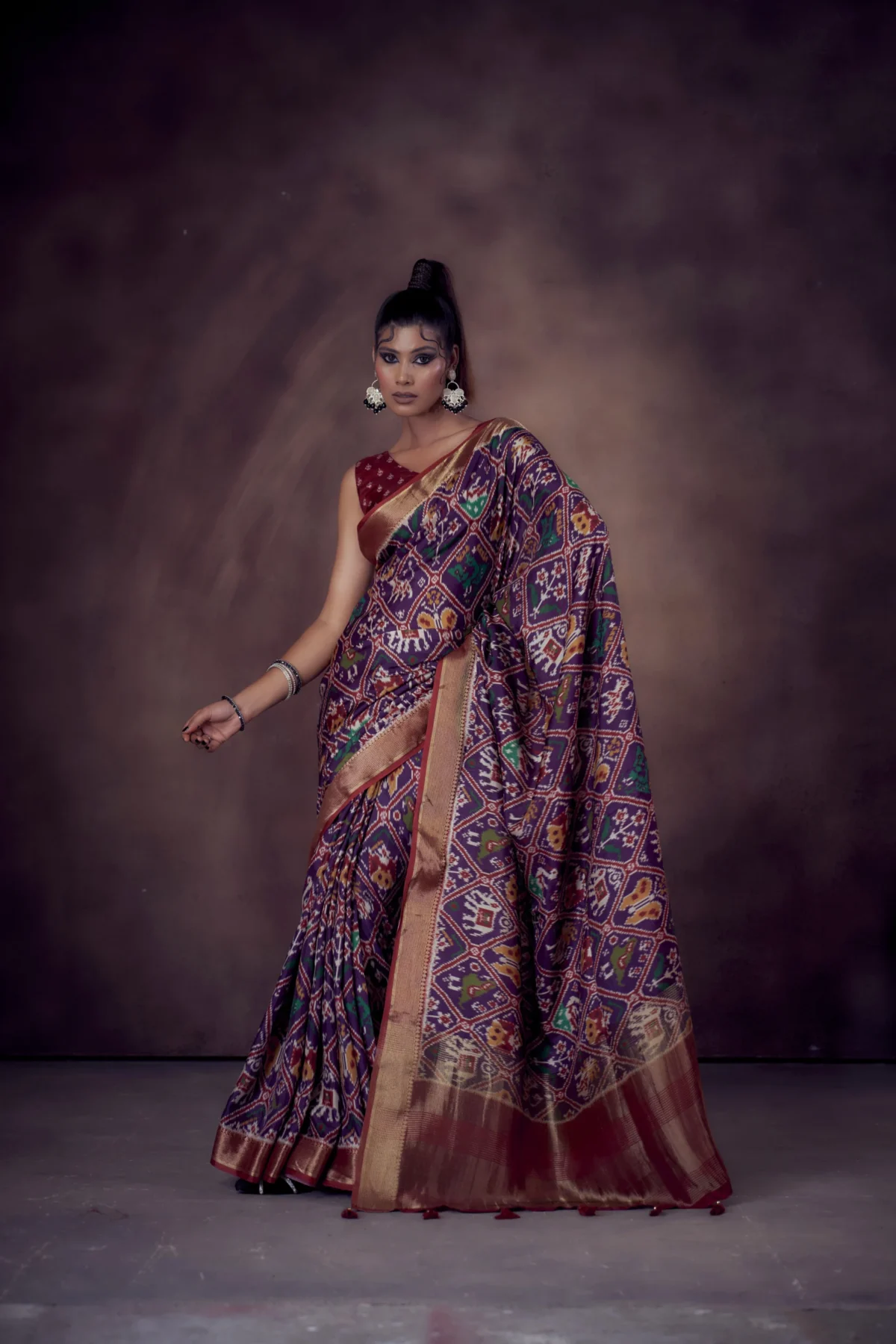 Indigo Patola print Moonga Tussar saree with woven zari border and traditional pallu