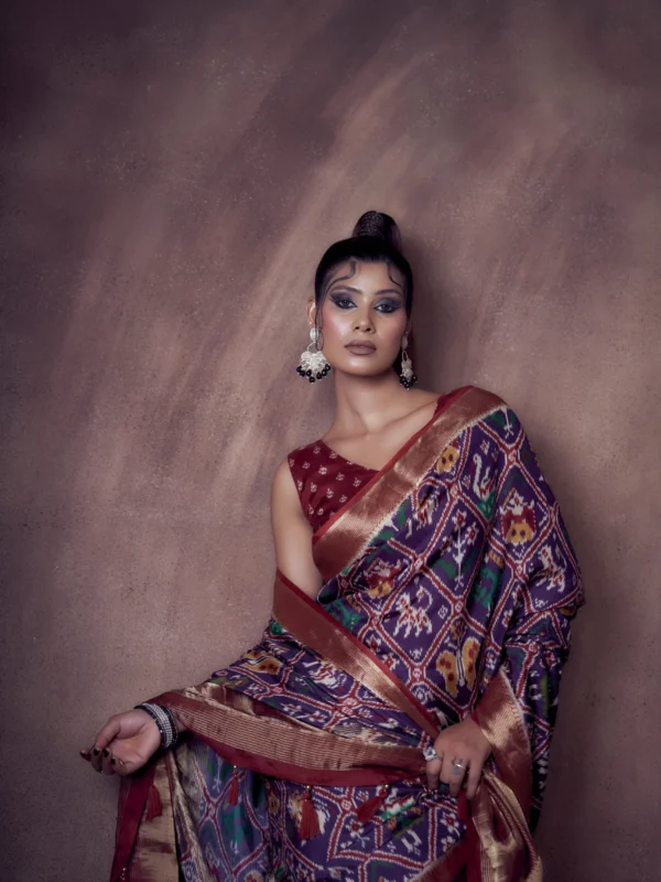 Indigo Patola print Moonga Tussar saree with woven zari border and traditional pallu