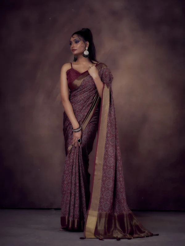 Maroon Mandala print Moonga Tussar saree with golden zari border and traditional pallu