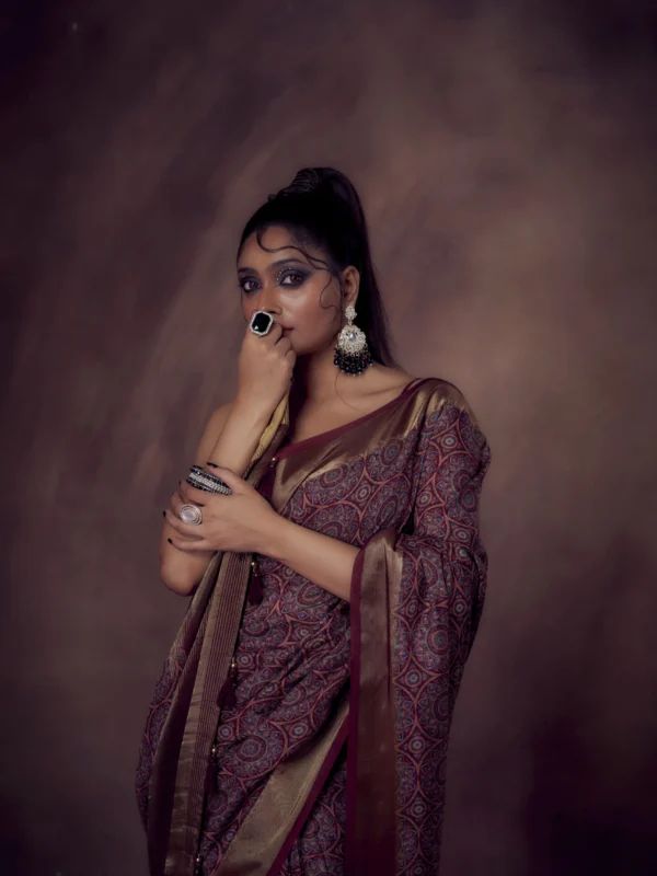 Maroon Mandala print Moonga Tussar saree with golden zari border and traditional pallu