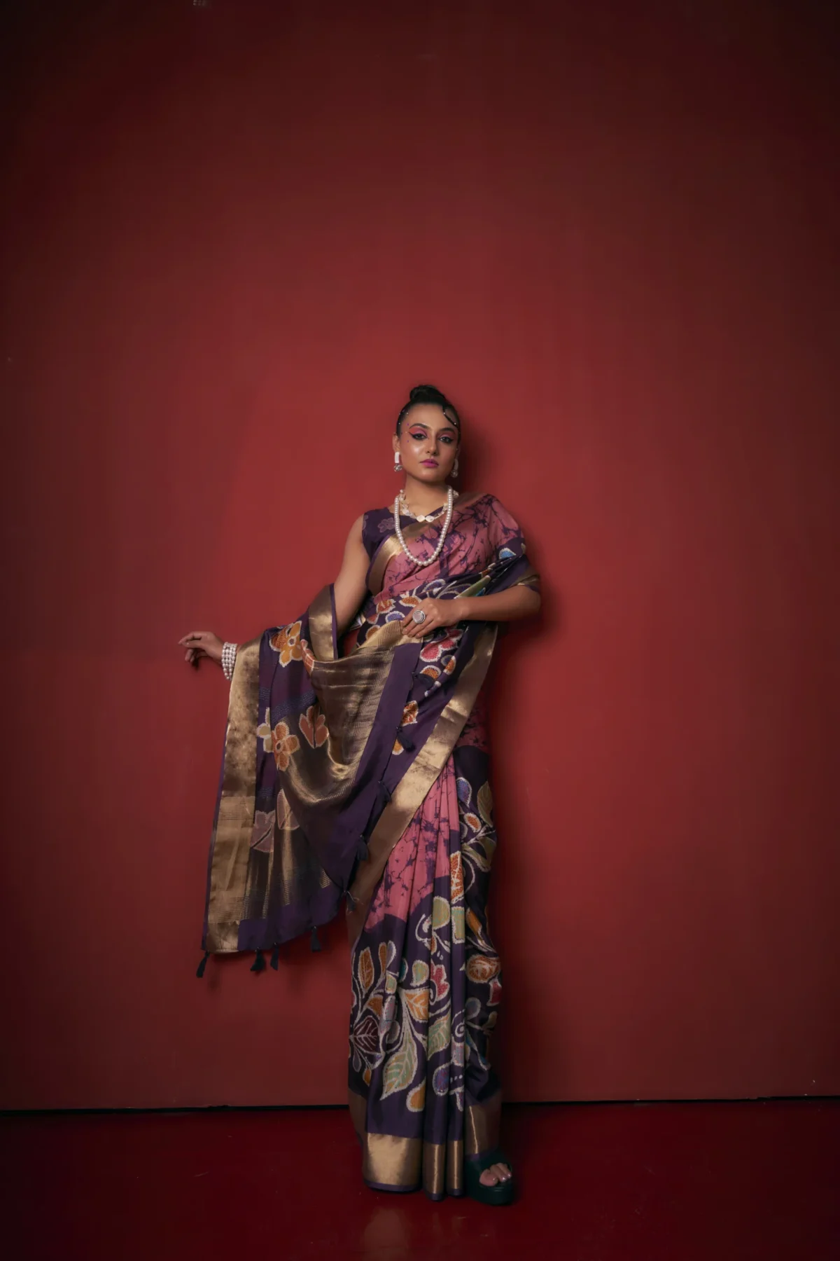 Aubergine and rose printed Moonga Tussar saree with golden zari border