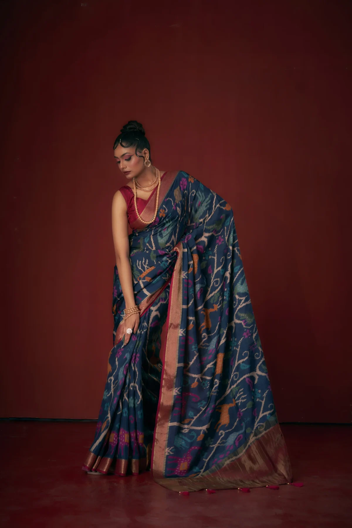 Teal Moonga Tussar printed saree with heritage motifs and woven jari border
