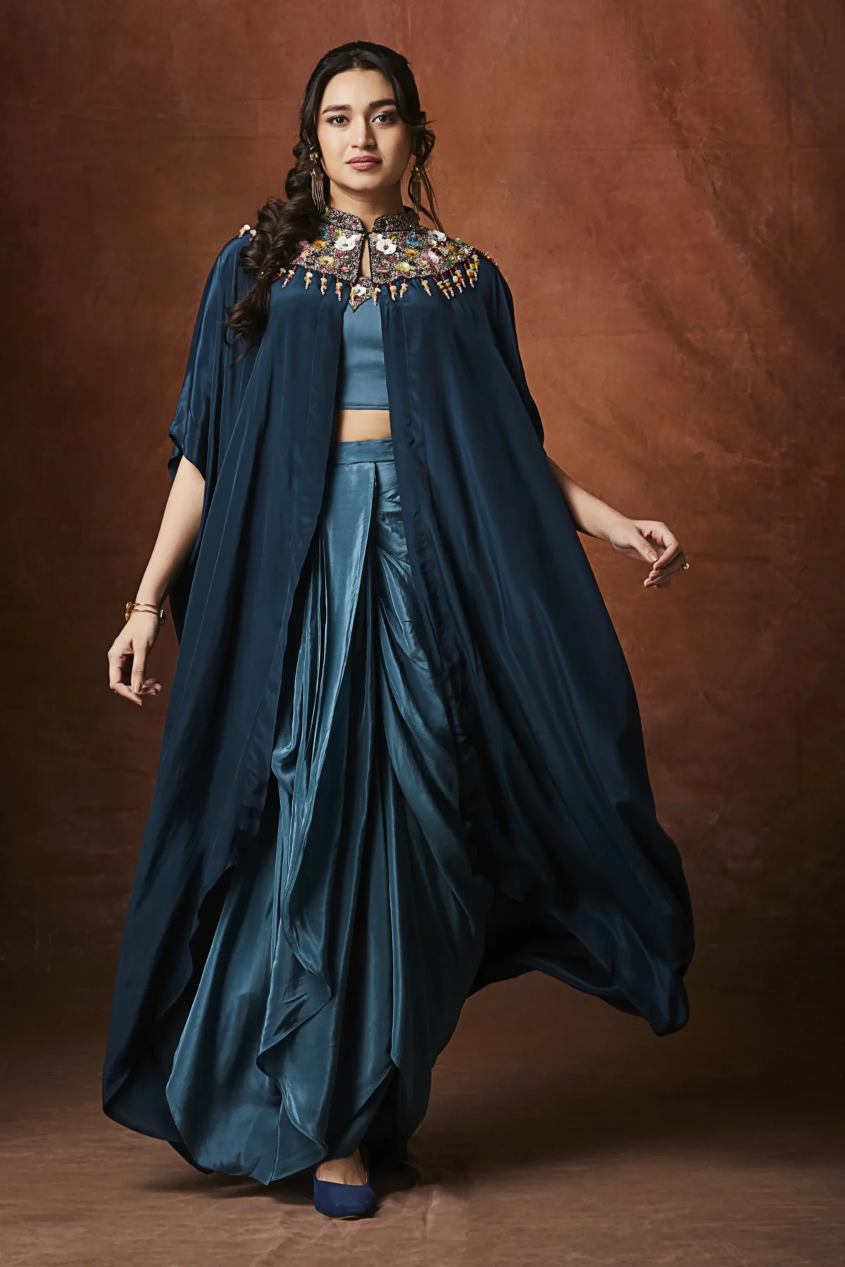 Teal draped plazo set with embellished cape for festive and cocktail wear
