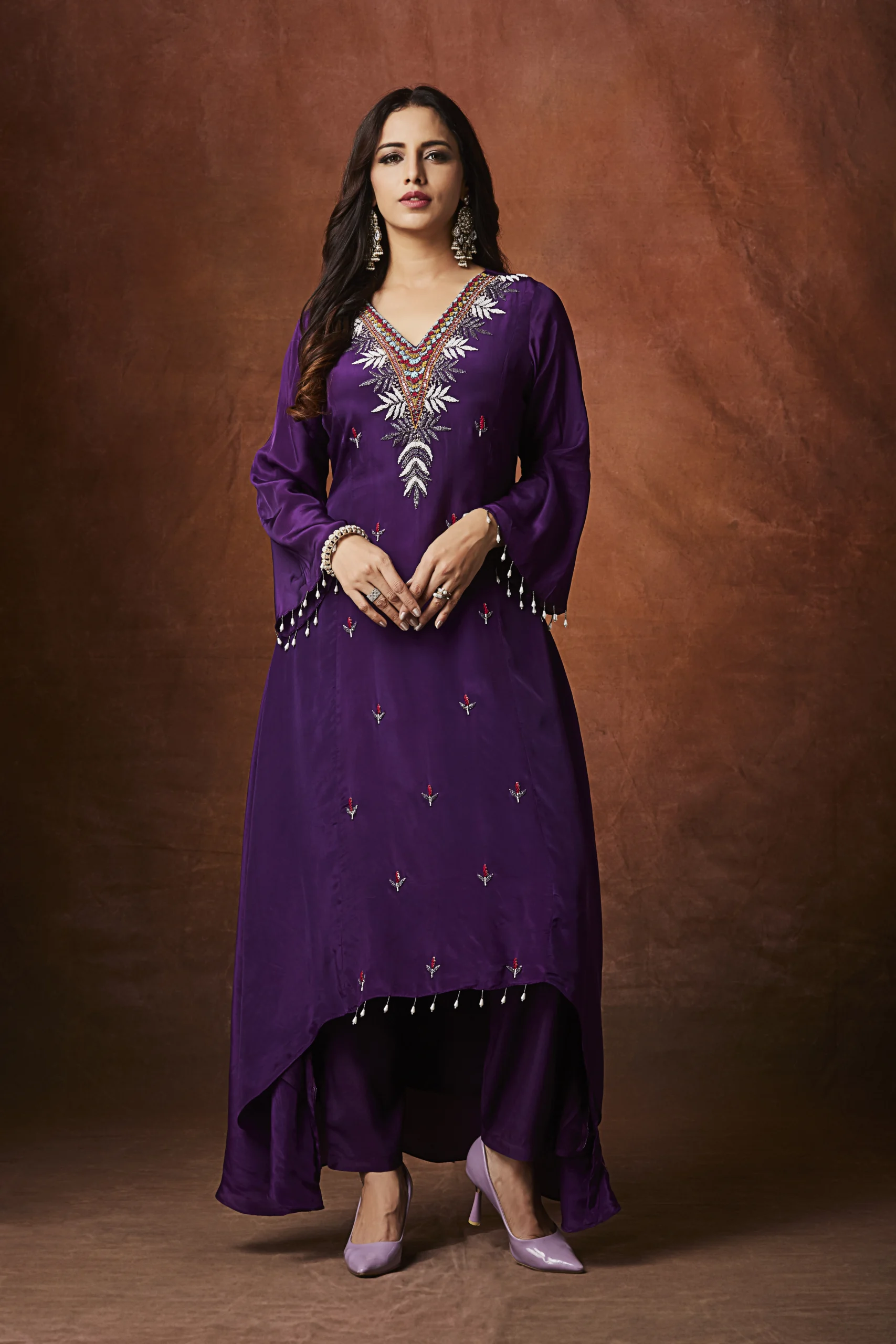 Purple designer palazzo suit with embroidered long kurta for festive wear