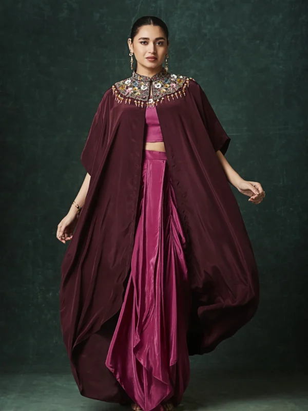 Burgundy draped plazo set with embellished cape for festive and cocktail wear