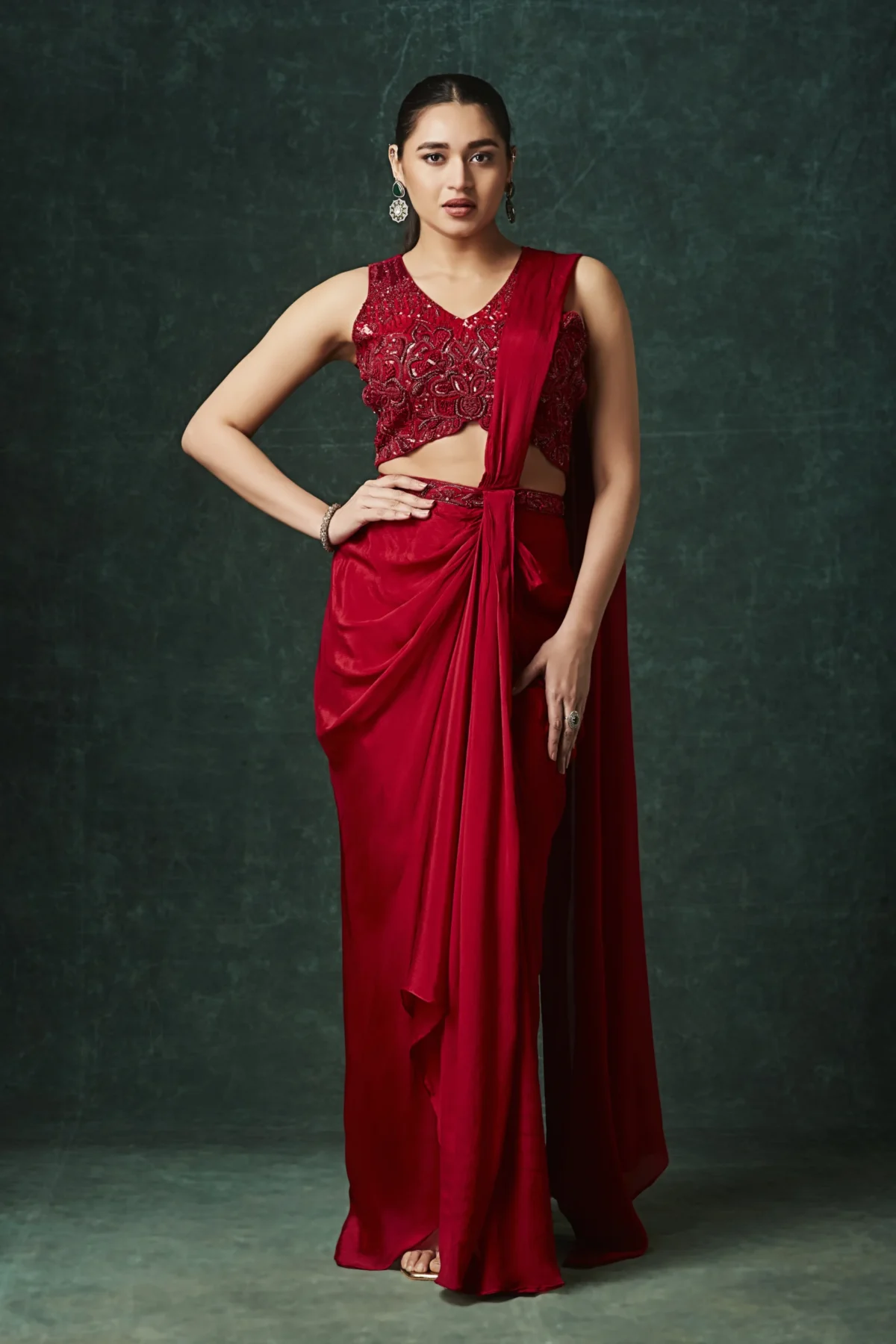 Crimson red designer draped saree with embroidered blouse for cocktail wear