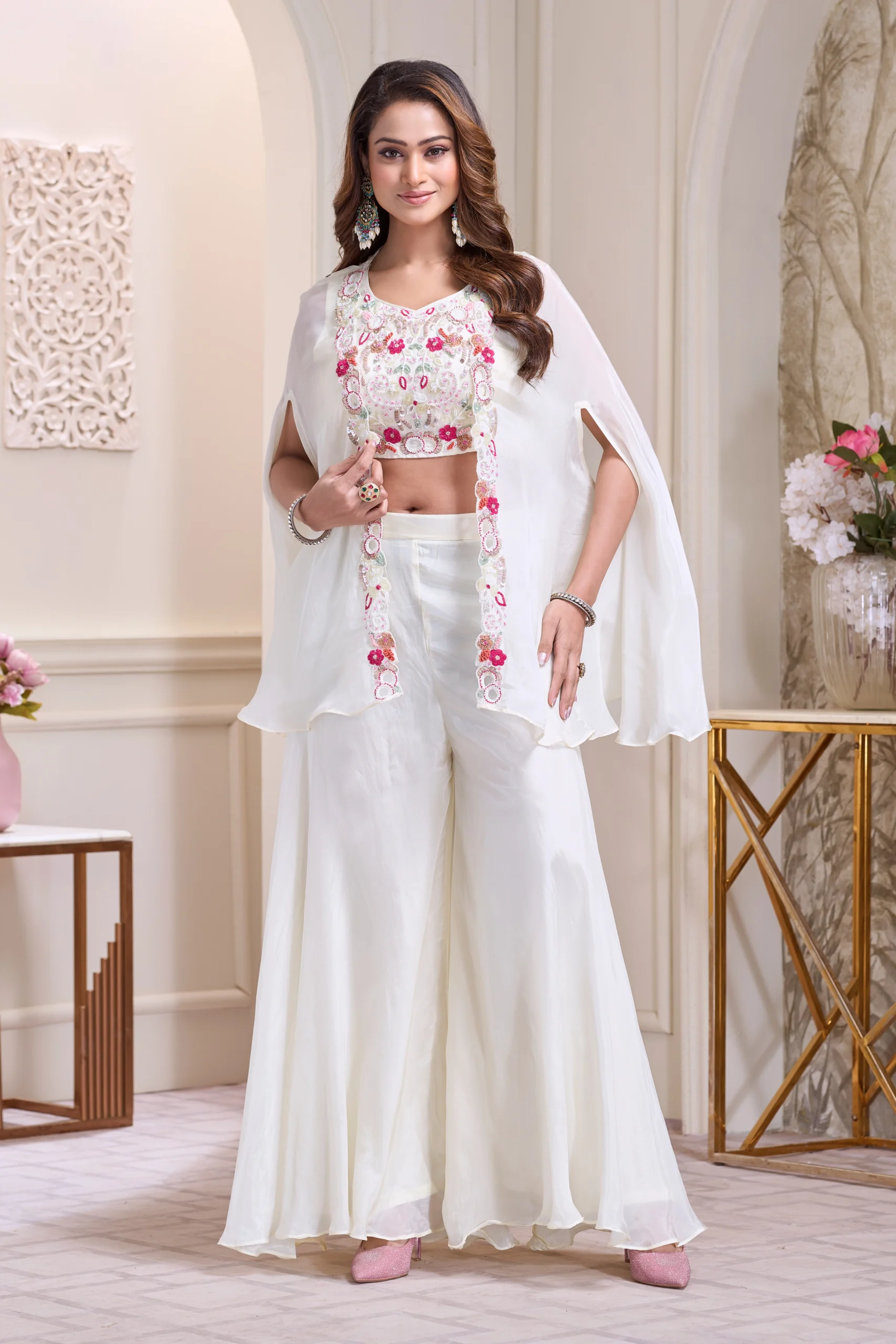 Ivory Indo Western cape set with floral embroidered blouse and wide leg palazzo pants for festive and wedding wear.