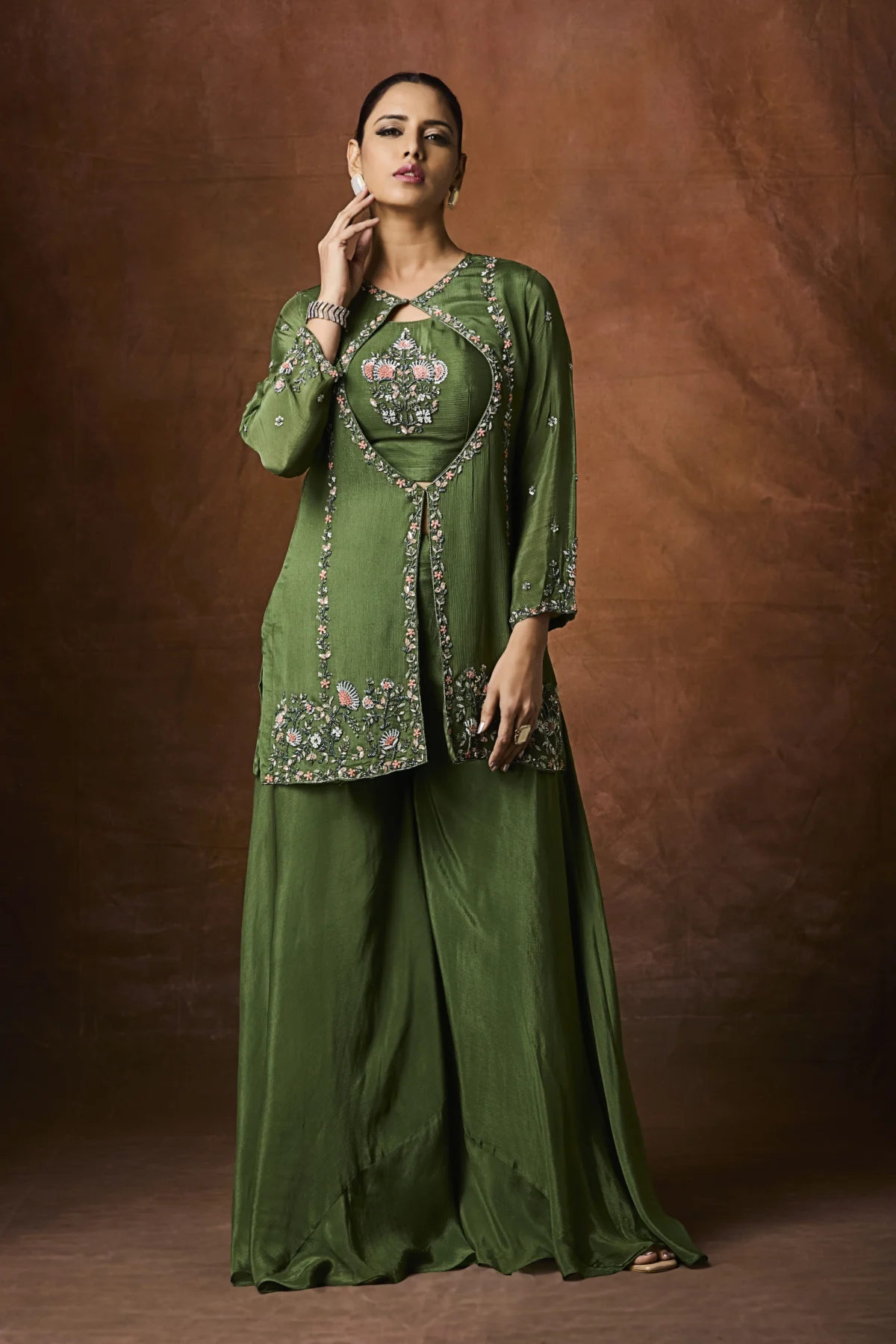 Forest green embroidered jacket-style Indo-Western outfit with coordinated flowy lower