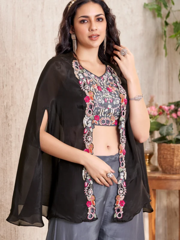 Black embroidered blouse with sheer cape overlay and grey wide flare bottoms Indo Western outfit for women.