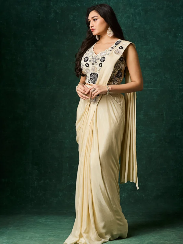 Ivory pre draped saree with black floral embroidered sleeveless blouse designer cocktail saree.