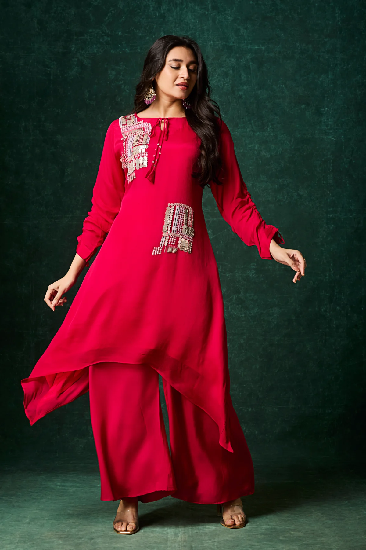 Scarlet red asymmetrical palazzo suit with metallic embellishment and wide leg pants for festive wear.