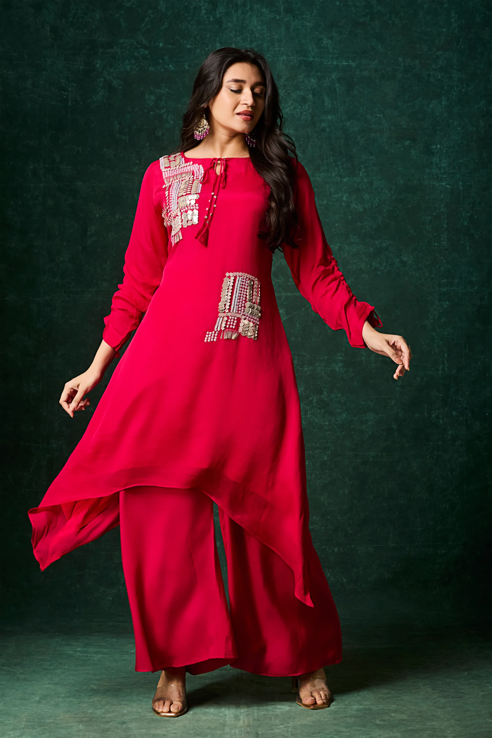 Scarlet red asymmetrical palazzo suit with metallic embellishment and wide leg pants for festive wear.