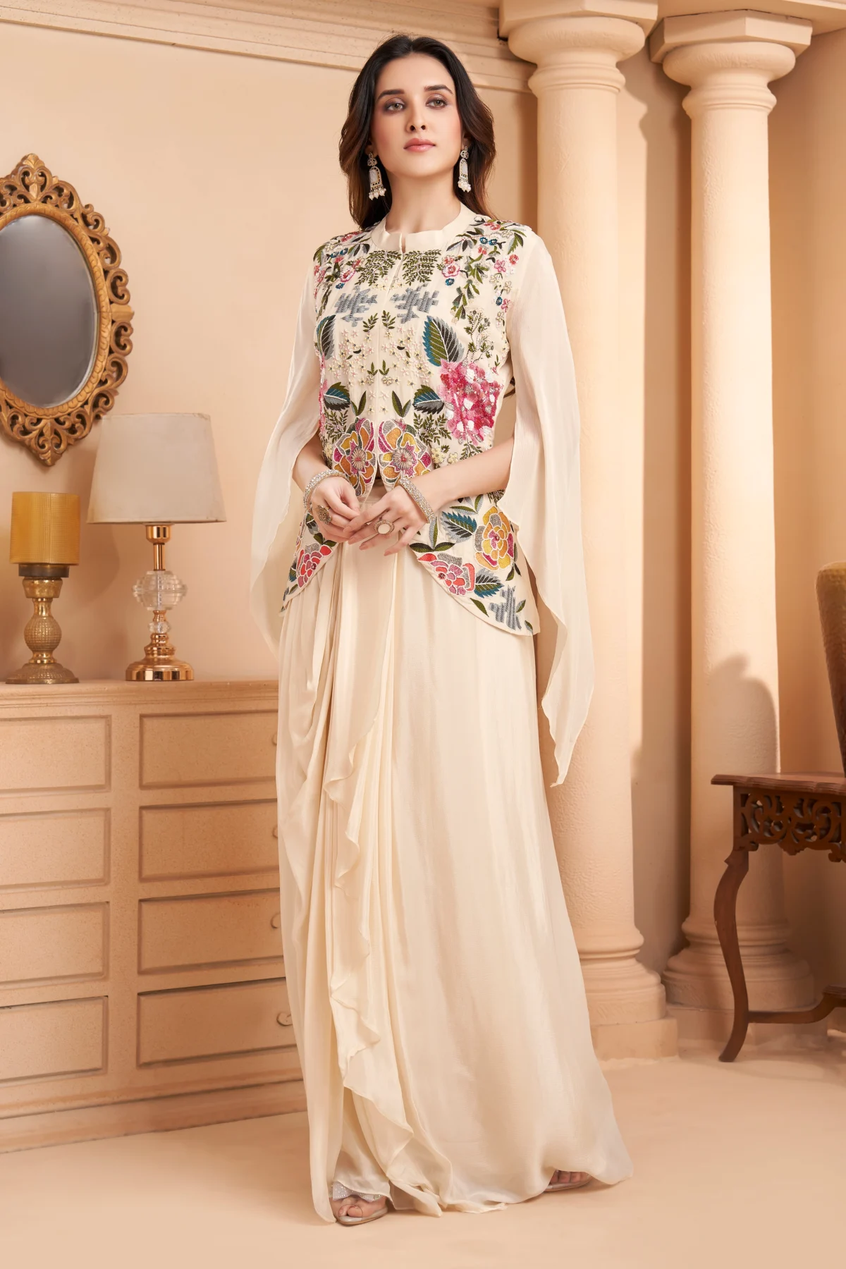 Ivory Indo Western drape set with multicolour floral embroidery and cape sleeves for wedding and festive wear.