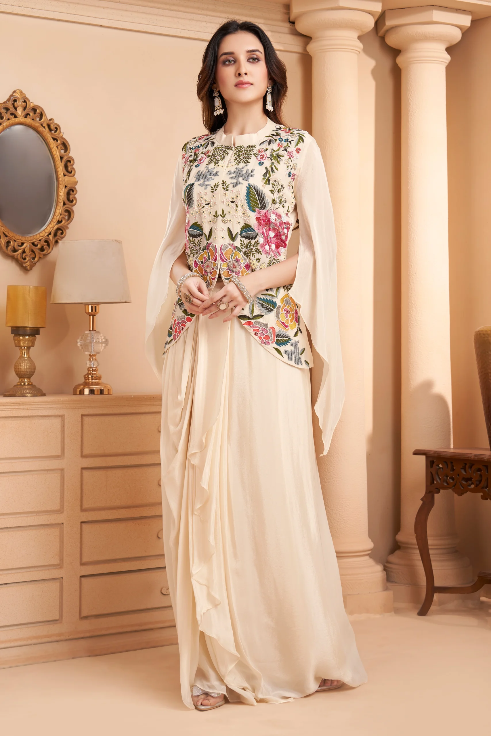 Ivory Indo Western drape set with multicolour floral embroidery and cape sleeves for wedding and festive wear.