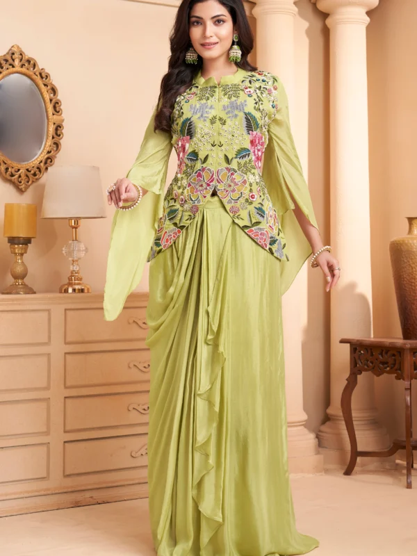 Pistachio green Indo Western drape set with floral embroidery, peplum bodice and cape sleeves for wedding and festive wear.