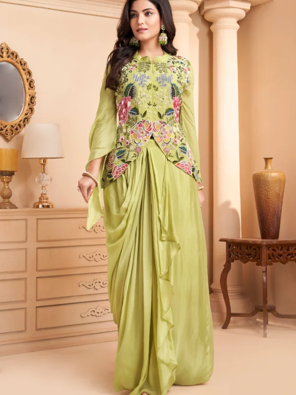 Pistachio green Indo Western drape set with floral embroidery, peplum bodice and cape sleeves for wedding and festive wear.