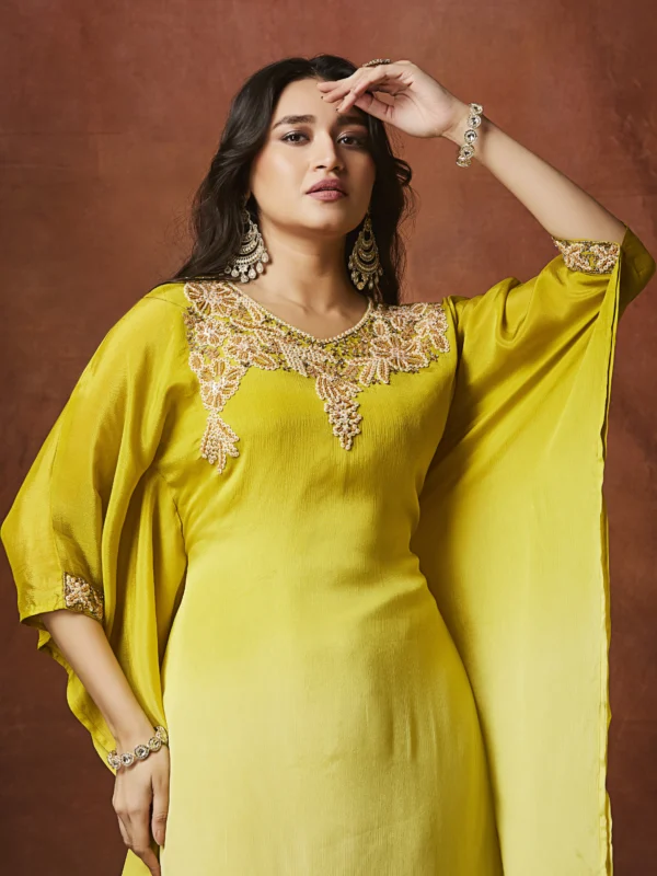 Sunshine yellow Indo Western cape kurta set with embellished neckline and straight slit pants for festive wear.