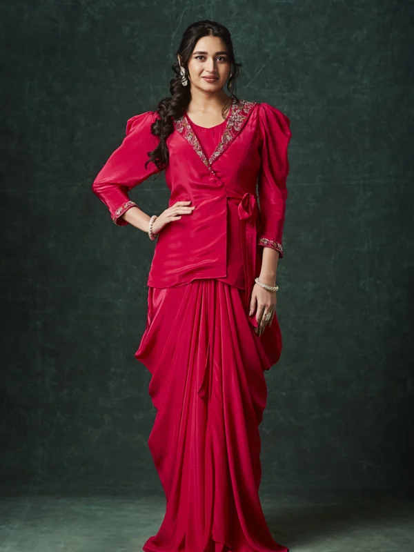 Purple draped Indo Western outfit with embellished wrap blouse and pleated flowing skirt for wedding reception wear.