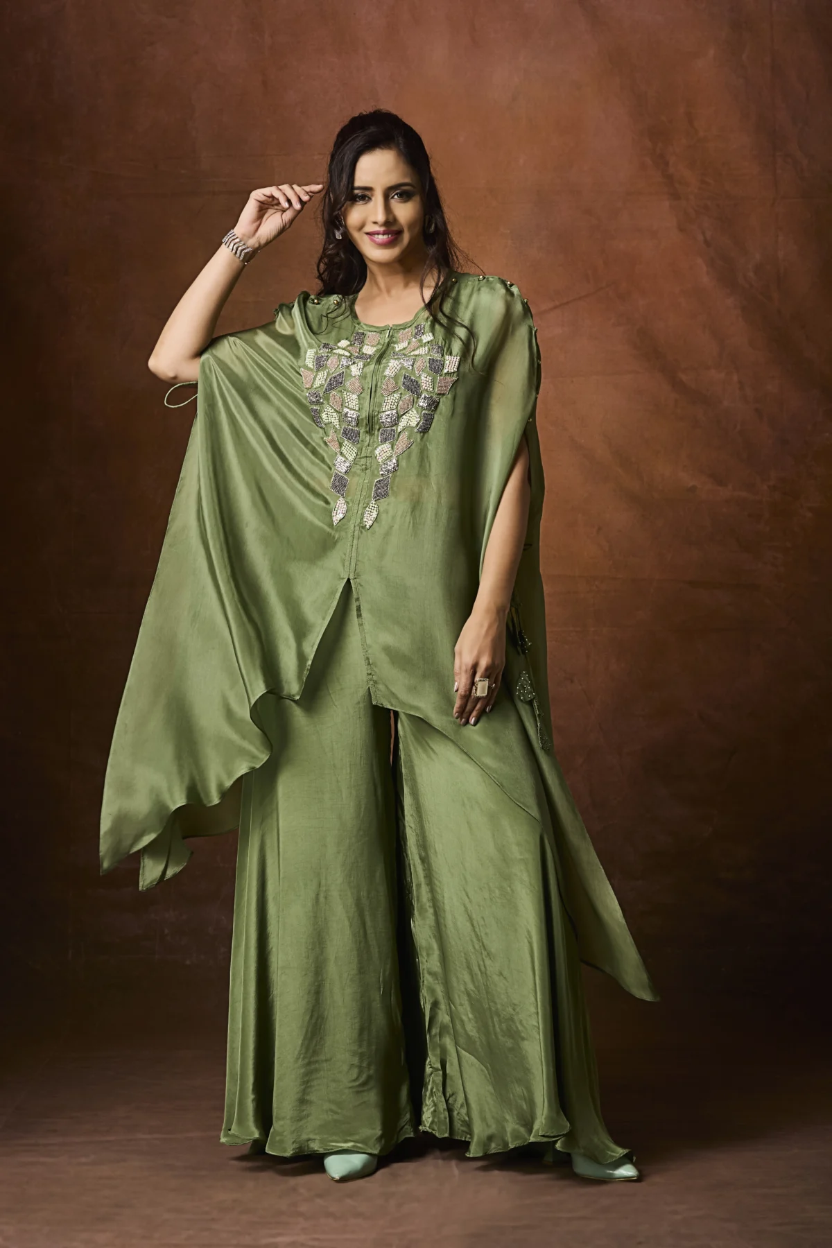 Olive green embroidered cape-style Indo-Western ensemble with flowy layered design