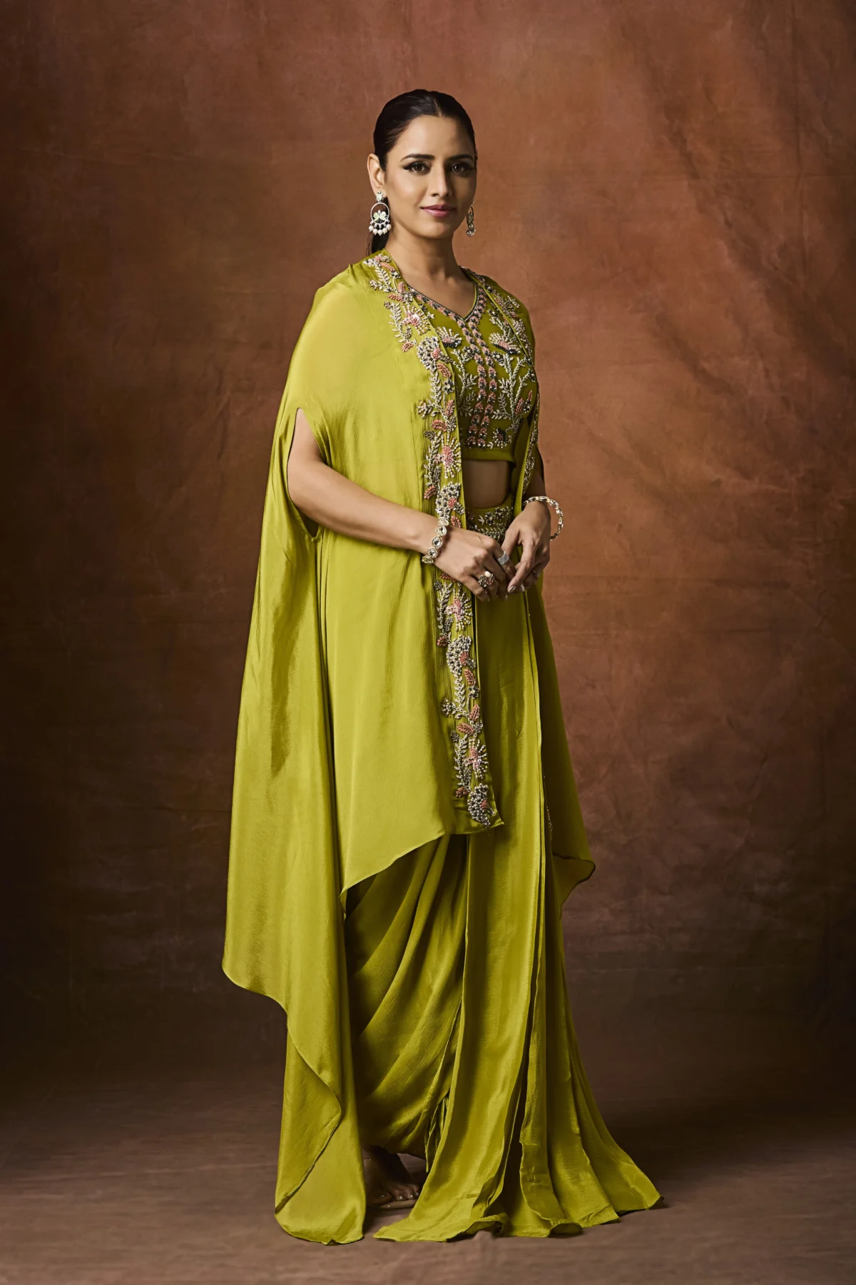 Olive green embellished cape and draped Indo-Western ensemble for festive wear