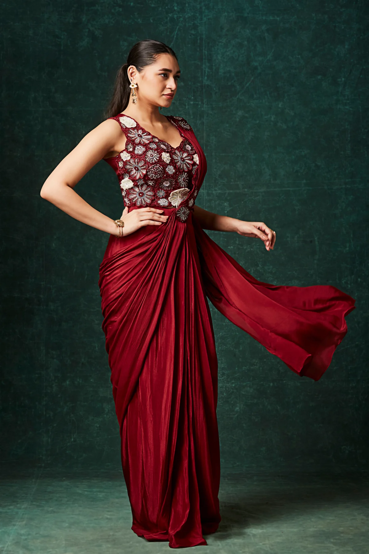 Ruby crimson pre draped saree with floral embroidered sleeveless blouse designer cocktail wear.