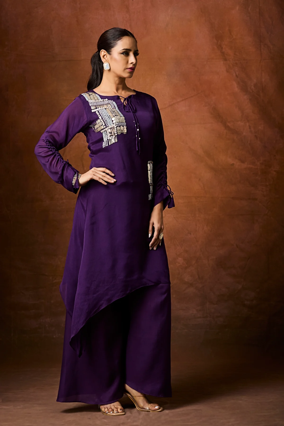 Amethyst purple asymmetrical palazzo suit with metallic embellishment and wide leg pants for festive wear.