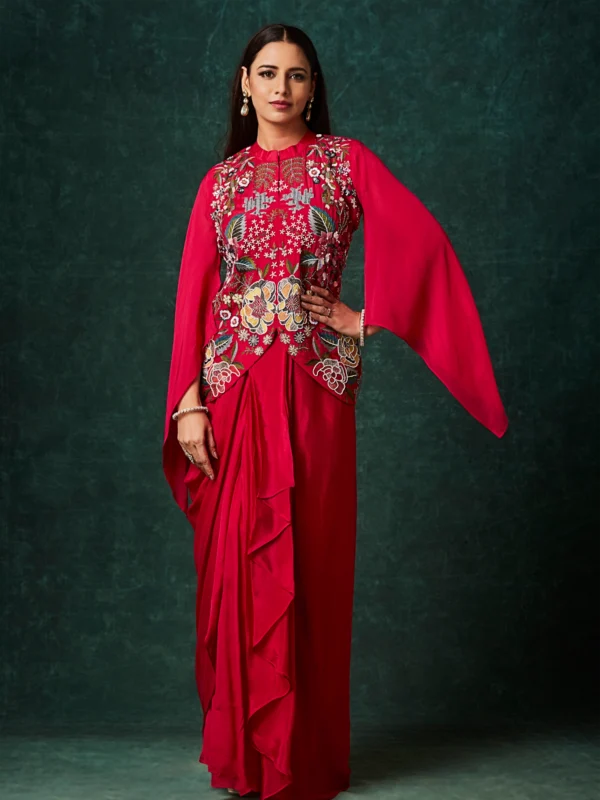 Crimson red Indo Western drape set with floral embroidered bodice and cape sleeves for reception and cocktail wear.