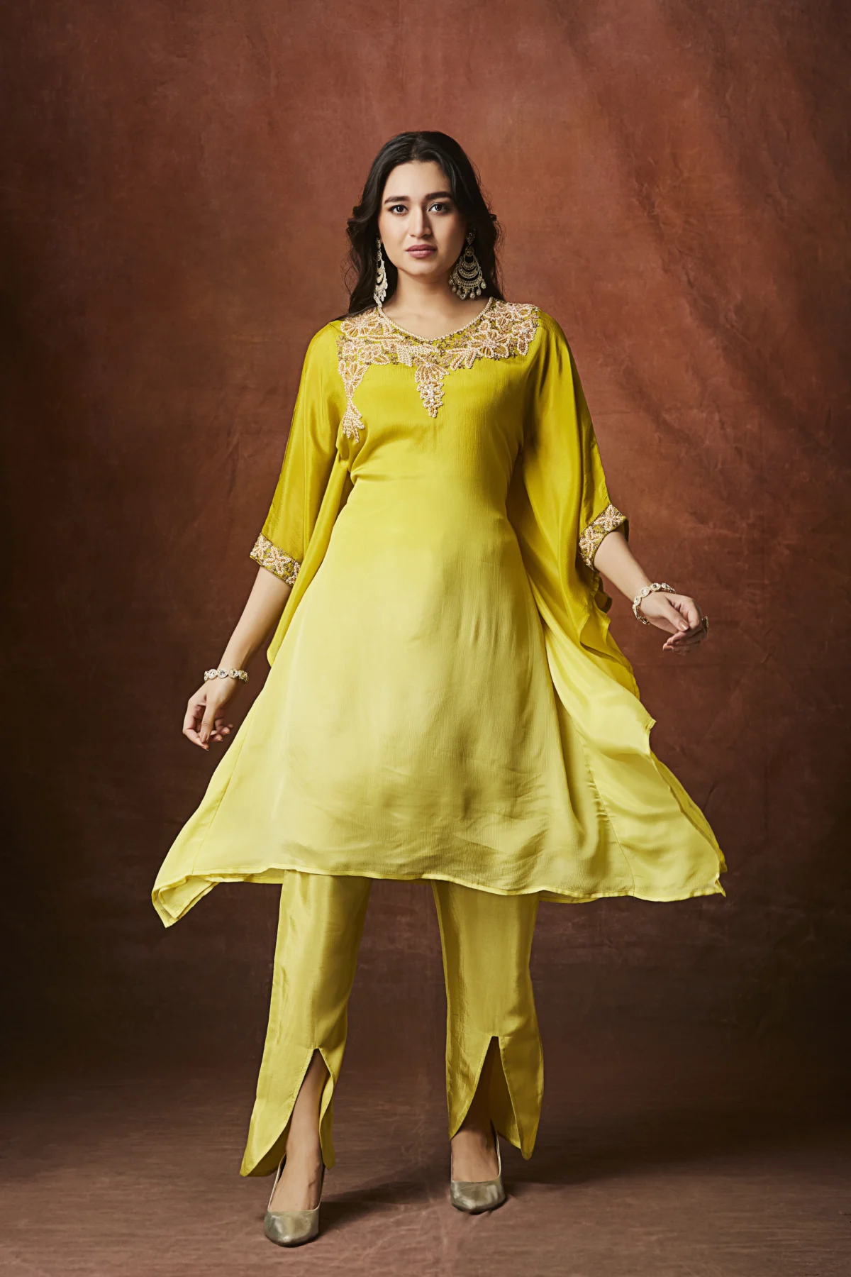 Sunshine yellow Indo Western cape kurta set with embellished neckline and straight slit pants for festive wear.