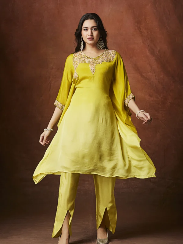 Sunshine yellow Indo Western cape kurta set with embellished neckline and straight slit pants for festive wear.