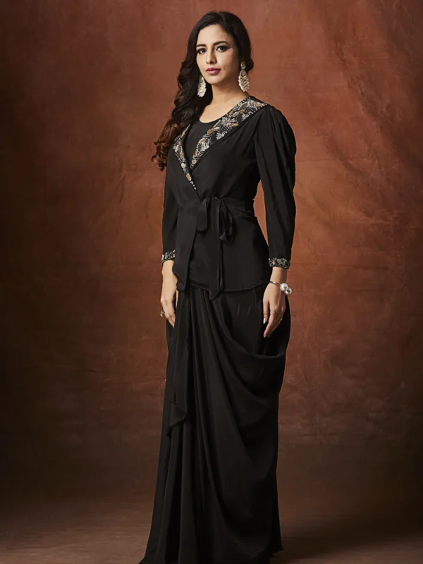 Black embellished Indo Western draped outfit with wrap blouse and long flowing skirt for evening wear.