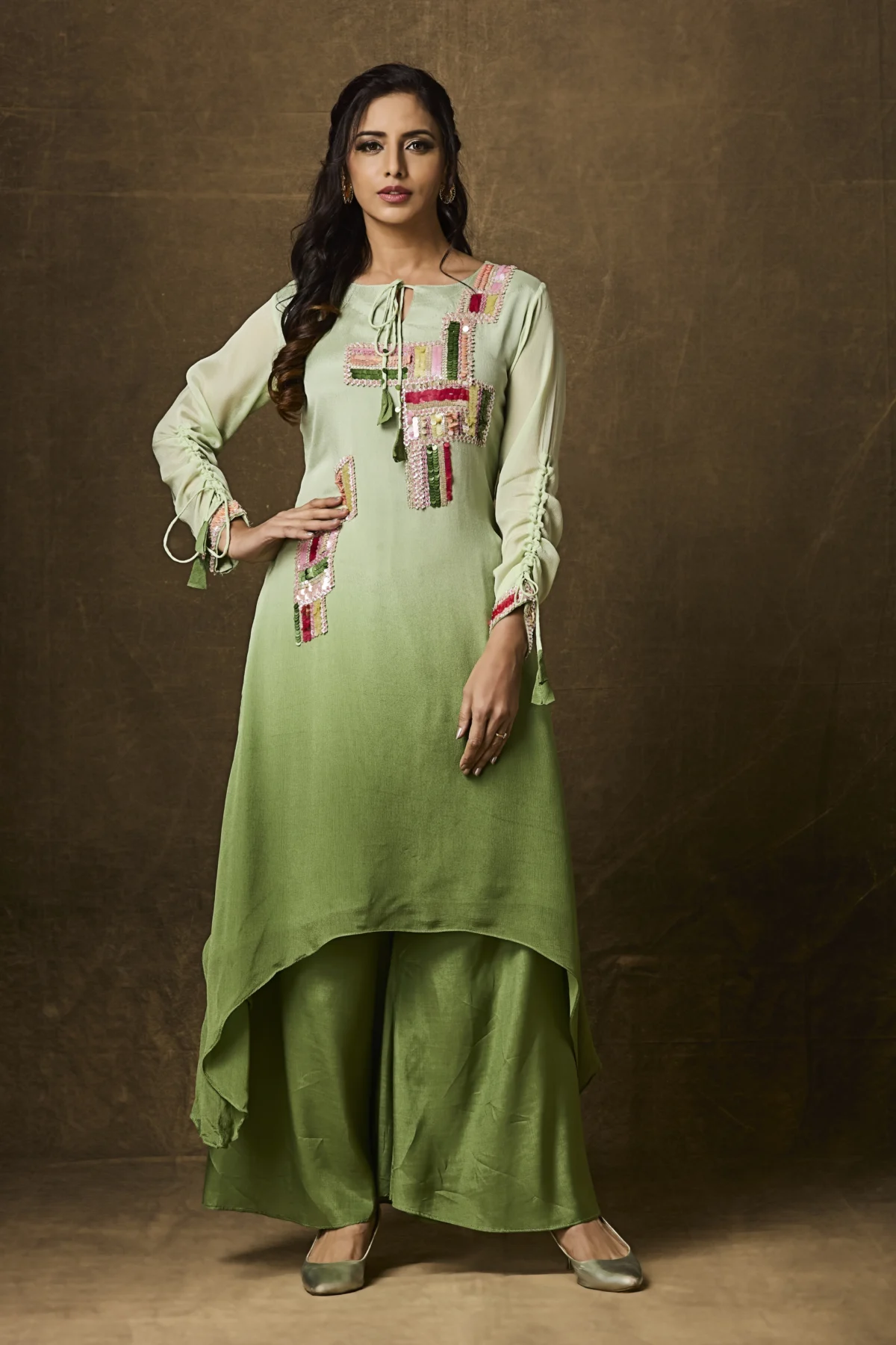 Olive green embroidered Indo Western palazzo set with asymmetrical kurta and festive multicolor thread work for women