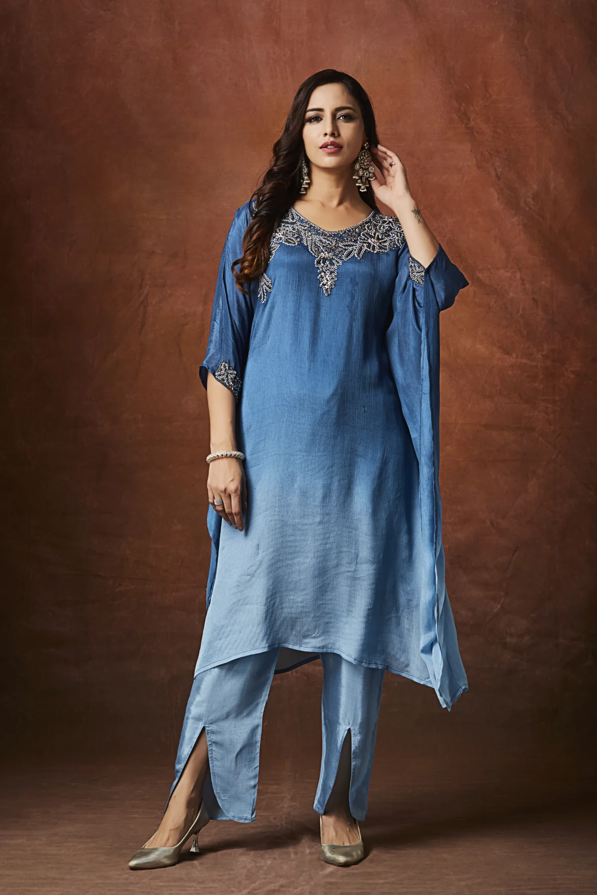 Azure blue Indo Western cape kurta set with silver embroidered neckline and straight pants for festive wear.