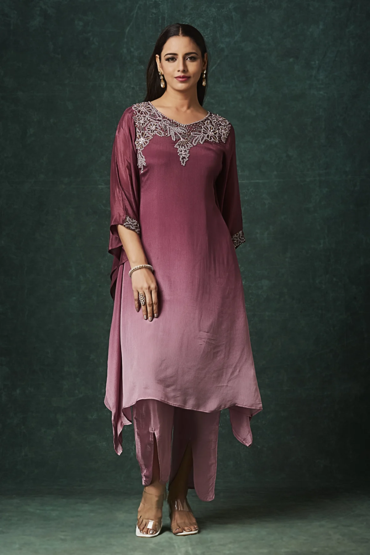 Mauve Indo Western kurta set with embellished neckline, cape sleeves and slit pants for festive wear.