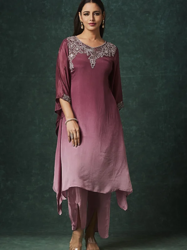 Mauve Indo Western kurta set with embellished neckline, cape sleeves and slit pants for festive wear.