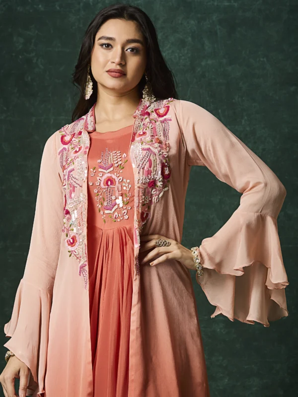 Peach layered Indo Western drape outfit with embroidered jacket and flared sleeves for wedding and festive wear