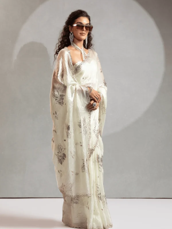 Ivory Shimmer Satin Silk Designer Saree with Floral Print and Embellished Lace Border for Wedding and Party Wear