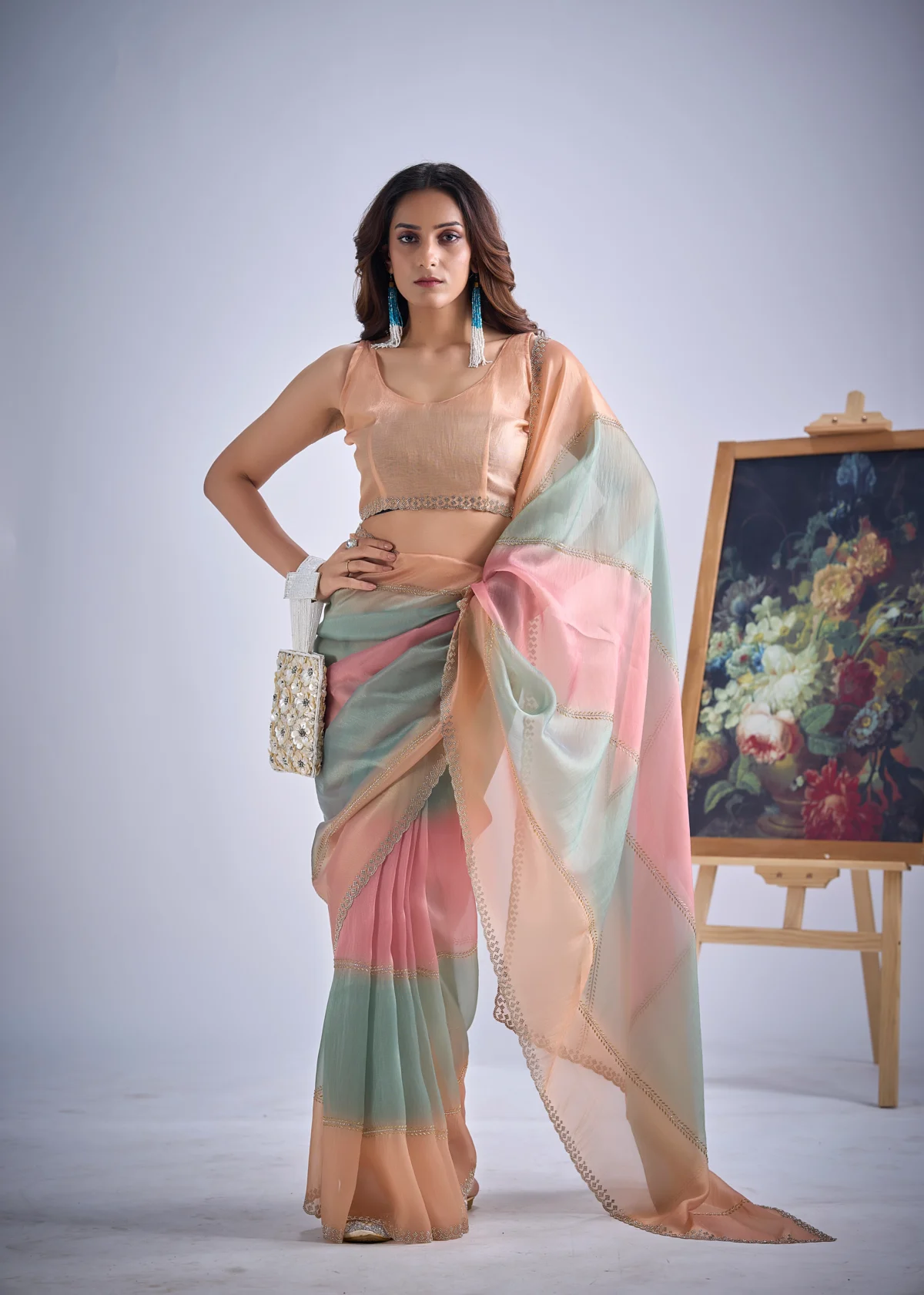 Celeste pastel colourblock organza tissue designer saree with embellished lace border for wedding, festive and party wear.