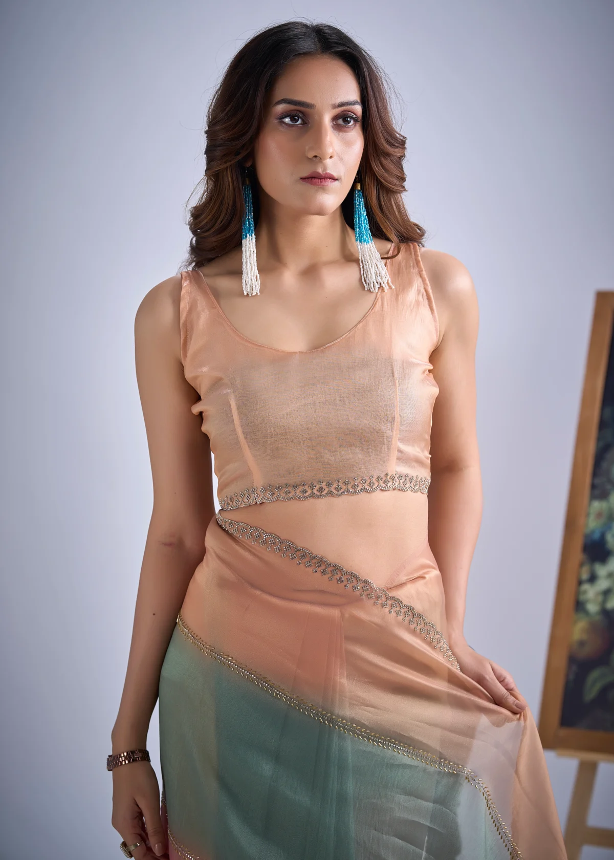 Celeste pastel colourblock organza tissue designer saree with embellished lace border for wedding, festive and party wear.